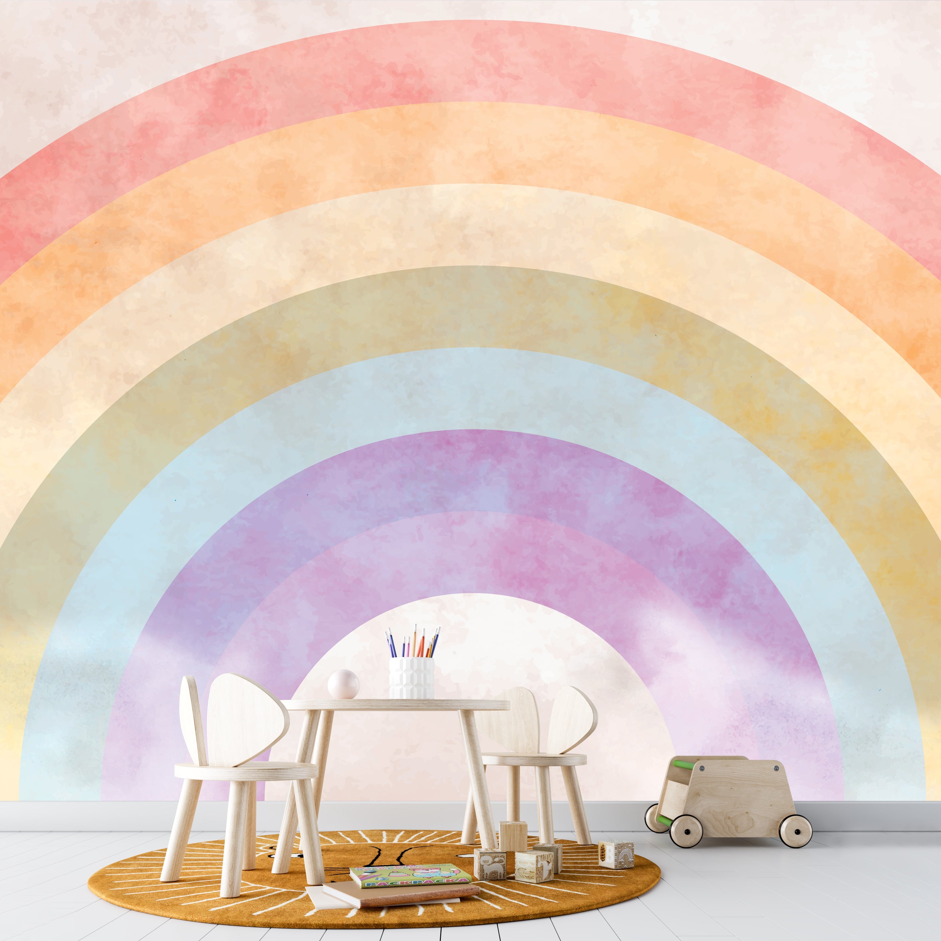Children's play area with a colorful rainbow mural on the wall. Wallpaper kids