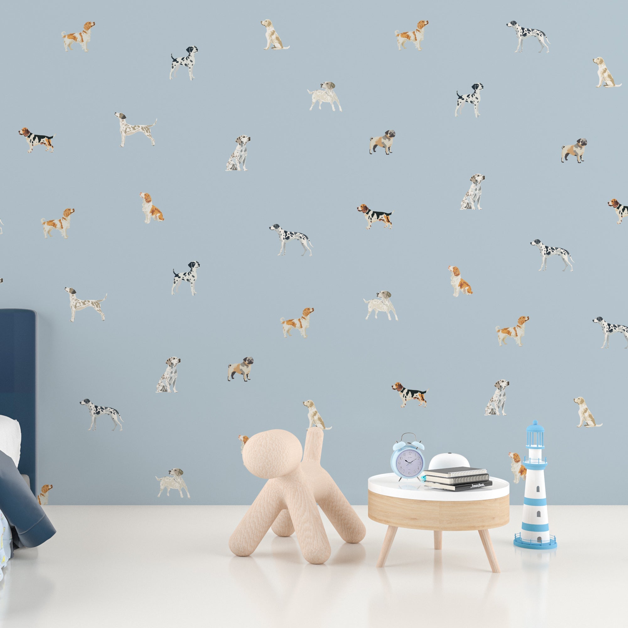 Wallpaper Kids Nursery Dubai Children's room with blue wall featuring dog illustrations, a teddy bear, and small table with toys.