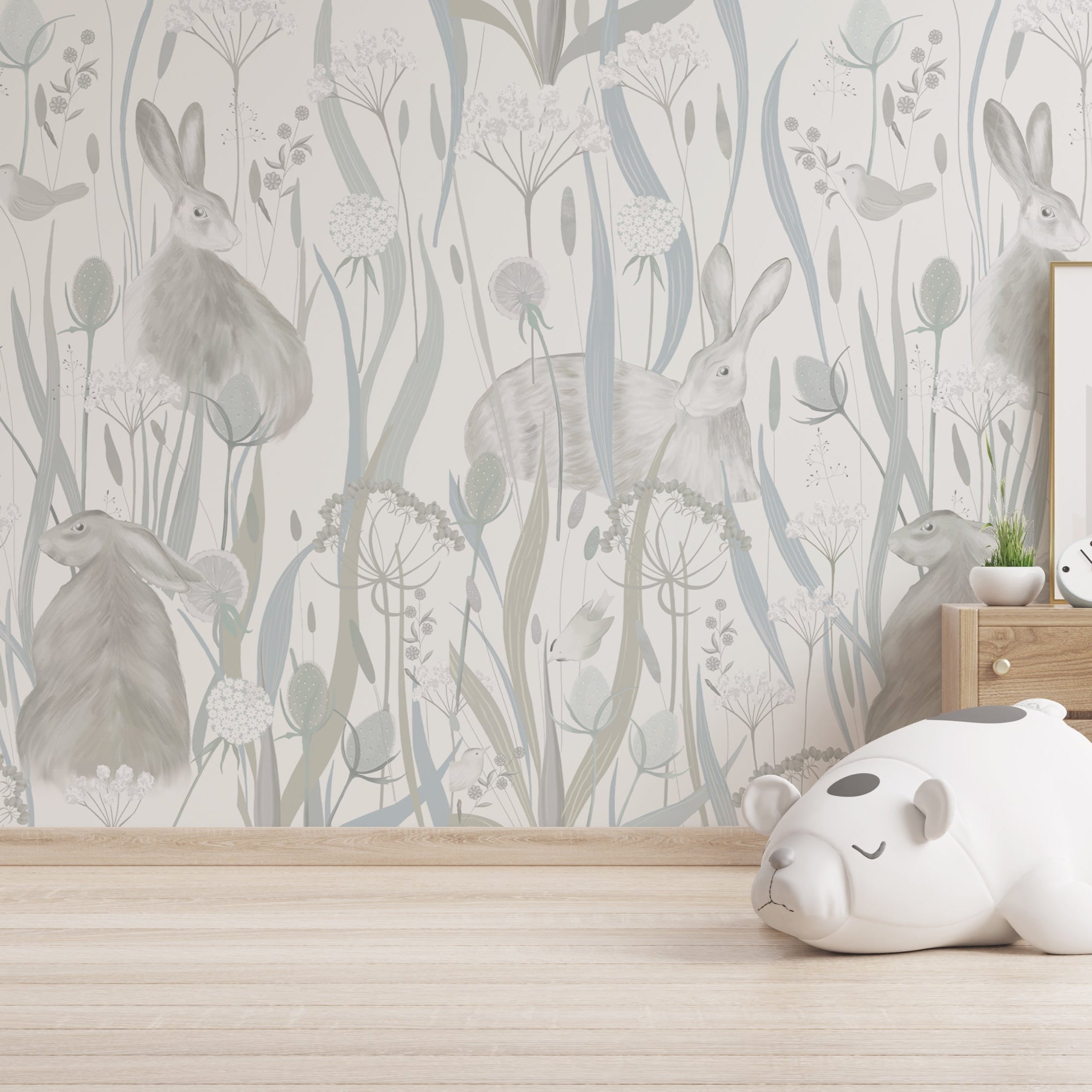 Wallpaper Kids Nursery Dubai Children's room with floral wallpaper, toys, and a wooden dresser.