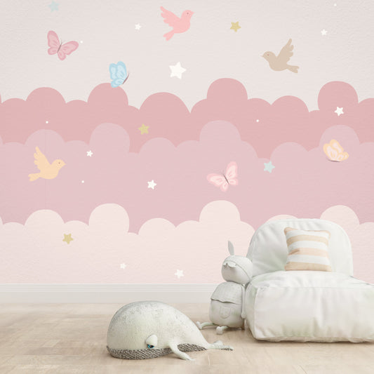 Wallpaper Kids Nursery Dubai Children's room with pink cloud-themed wallpaper, white furniture, and decorative pillows.
