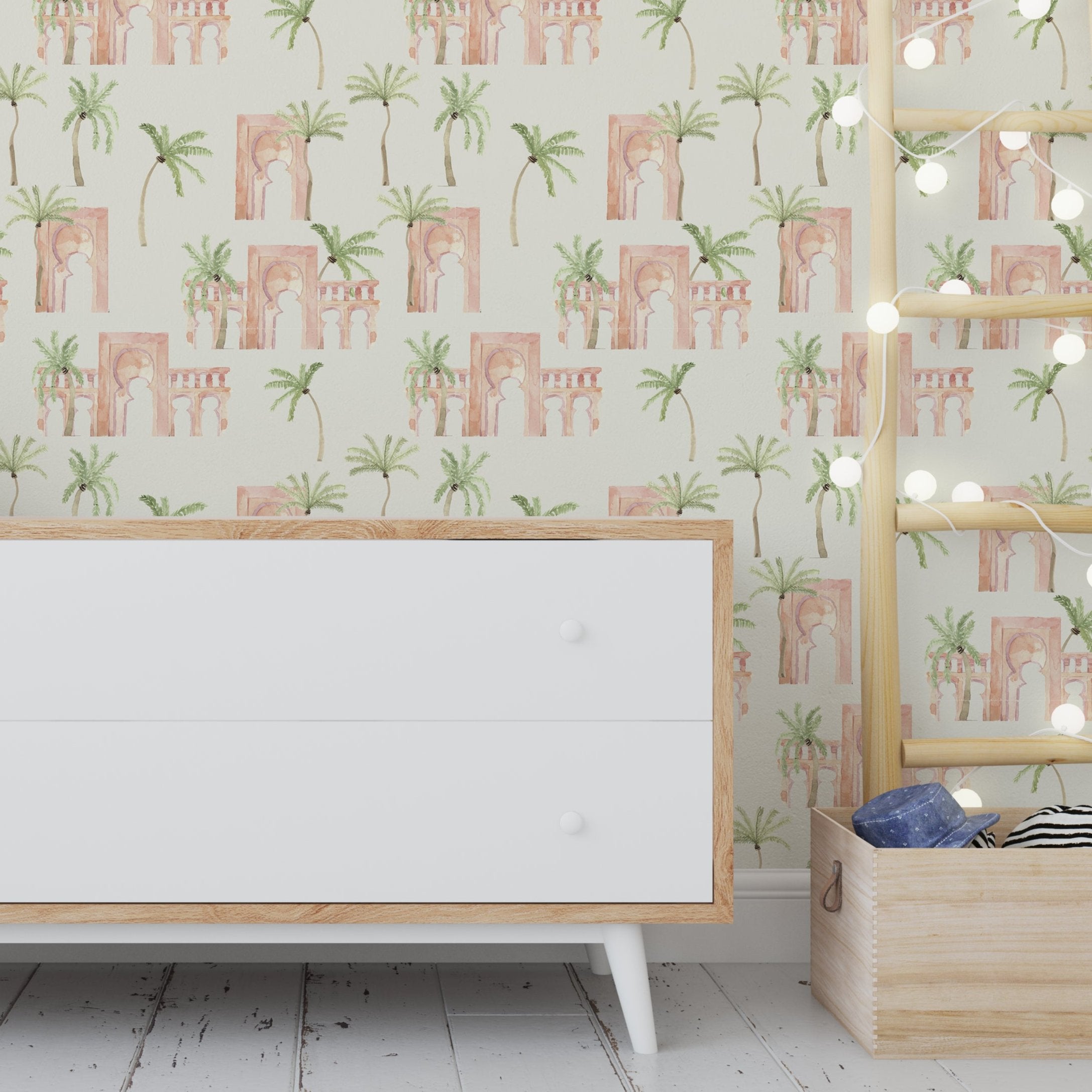 Wallpaper Kids Nursery Dubai Peps Wall Interior room setting featuring a white drawer unit with a beige trim, placed against a wall with a tropical-themed, abstract and graffiti art wallpaper.