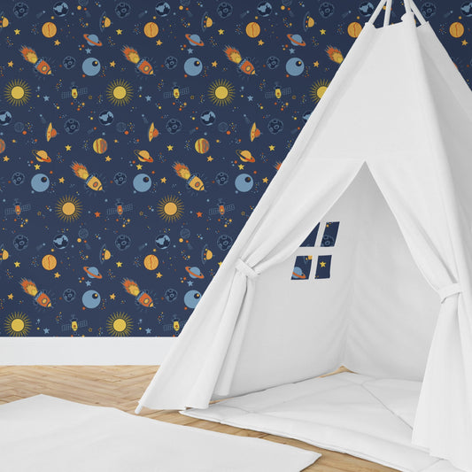 Wallpaper Kids Nursery Dubai Peps Wall A children's play tent with a space-themed pattern, featuring rockets and stars, set up on a wooden floor against a blue wall.