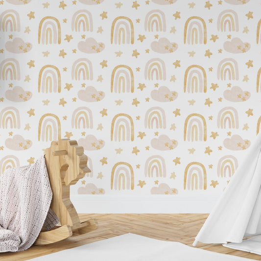 Wallpaper Kids Nursery Dubai Peps Wall A room with a white wallpaper featuring a pattern of golden rainbows and clouds. There is a wooden rocking horse and a person in a white dress with a flowing scarf in the foreground.