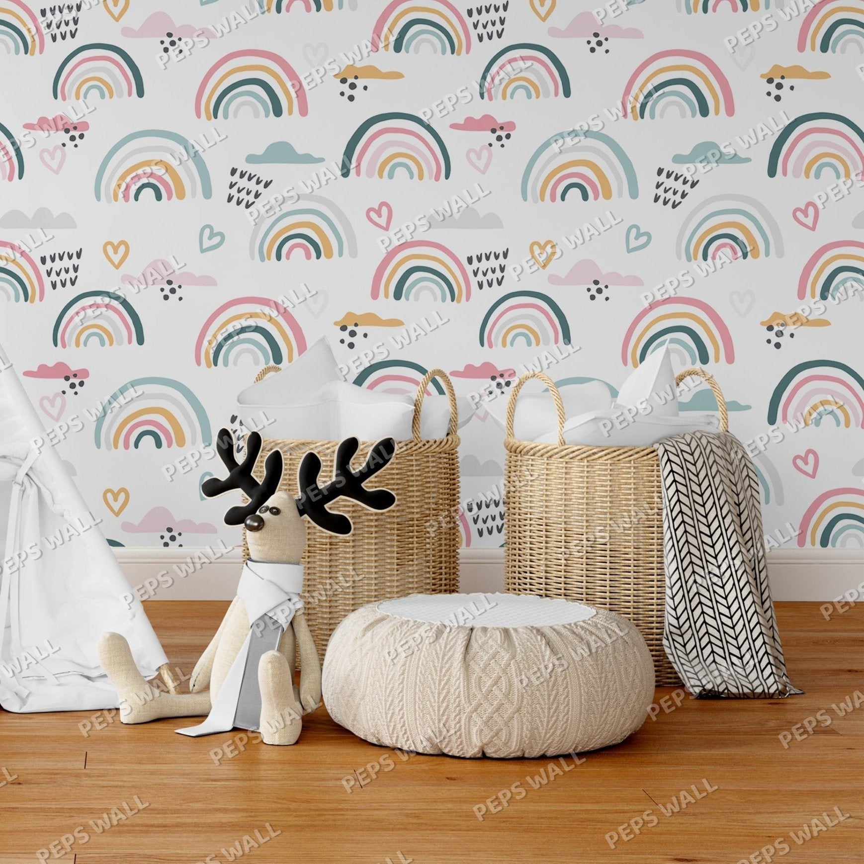 Wallpaper Kids Nursery Dubai Peps Wall A set of children's decor featuring a reindeer, a wicker basket, a knit throw, and a plush toy, all with rainbow and heart patterns, against a wall with a rainbow and hearts wallpaper.