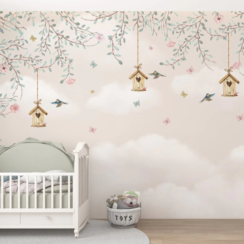 Wallpaper Kids Nursery Dubai Peps Wall A wall mural featuring floral patterns, birds, and birdhouses in a pastel color palette, installed in a room with a crib and toys.