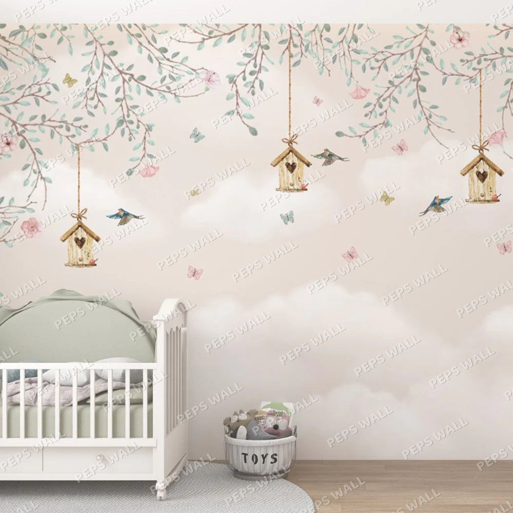 Wallpaper Kids Nursery Dubai Peps Wall A wall mural featuring floral patterns, birds, and birdhouses in a pastel color palette, installed in a room with a crib and toys.