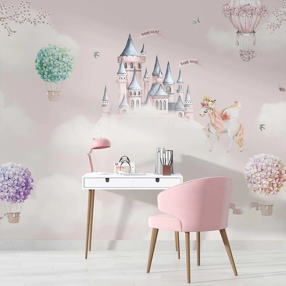 Wallpaper Kids Nursery Dubai Peps Wall A wall mural featuring a whimsical castle with pastel colors, surrounded by clouds, butterflies, and a hot air balloon, with a pink chair and white desk in the foreground.
