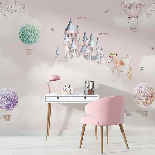 Wallpaper Kids Nursery Dubai Peps Wall A wall mural featuring a whimsical castle with pastel colors, surrounded by clouds, butterflies, and a hot air balloon, with a pink chair and white desk in the foreground.