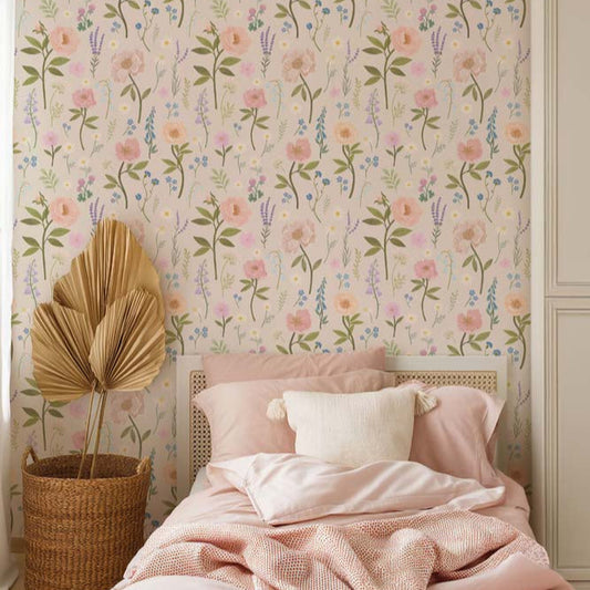 Wallpaper Kids Nursery Dubai Peps Wall A bedroom with floral wallpaper featuring pink, yellow, and blue flowers and a bed with pink bedding.