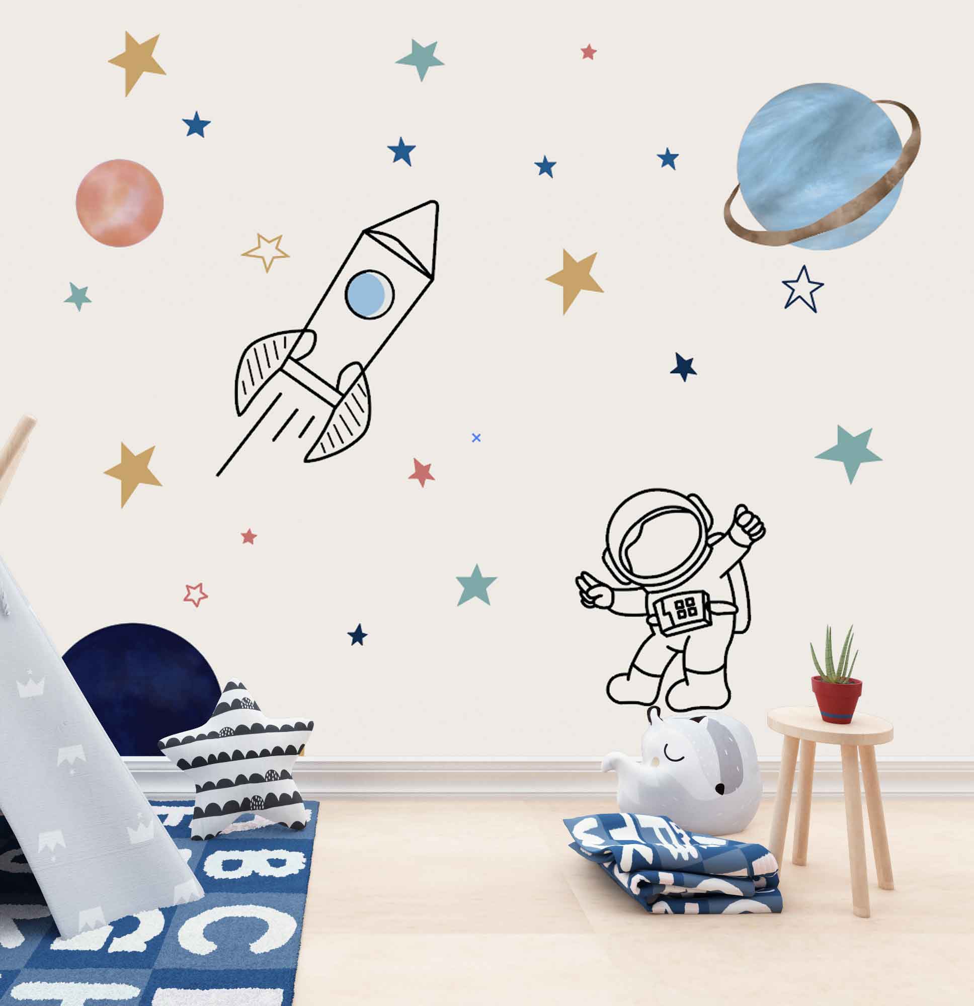 Wallpaper Kids Nursery Dubai Peps Wall A collection of space-themed wall decals including a rocket, an astronaut, and stars, placed on a white wall in a room with furniture.