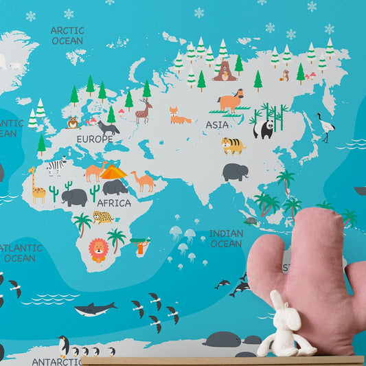 Wallpaper Kids Nursery Dubai Peps Wall A wall map of the world with illustrated animals and geographical features, displayed in a room setting with a toy rabbit in the foreground.