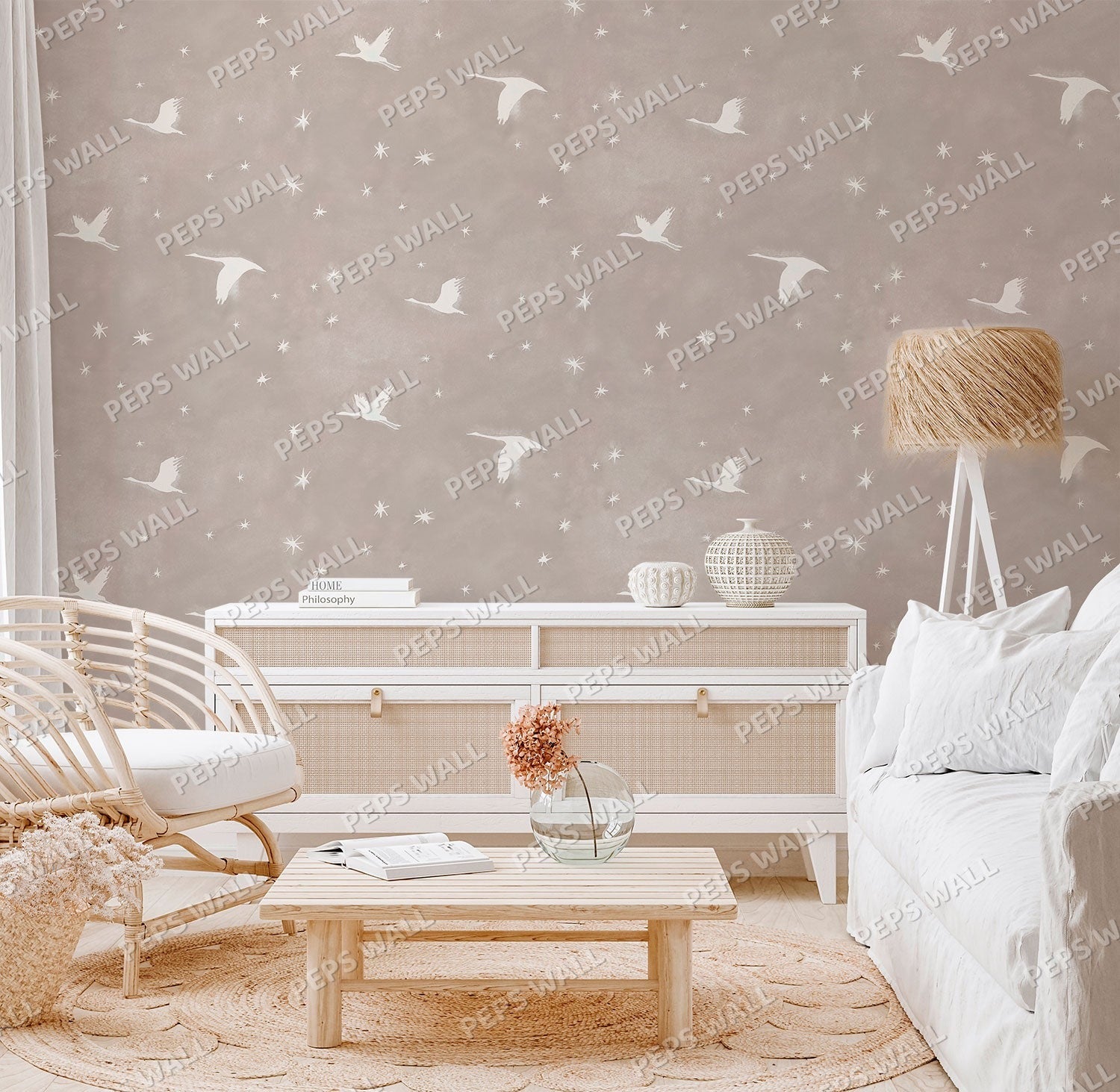 Wallpaper Kids Nursery Dubai Peps Wall A room with beige wallpaper featuring a pattern of white birds in flight. The room is furnished with a white sofa, a wooden coffee table, and a white sideboard.