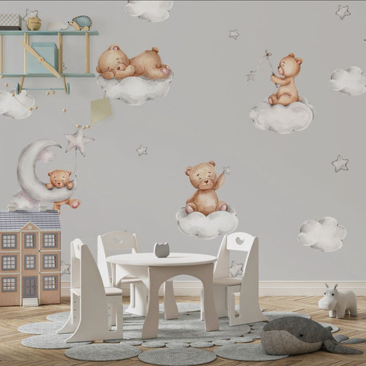 Wallpaper Kids Nursery Dubai Peps Wall Children's nursery room with wallpaper featuring cartoon teddy bears on a cloud-themed background, with a small wooden table and chairs in the foreground.