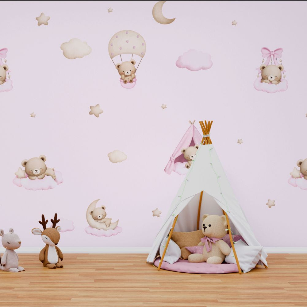Wallpaper Kids Nursery Dubai Peps Wall Children's room with pink wallpaper featuring teddy bears, hot air balloons, and stars. A toy tent and teddy bears are also present in the room.
