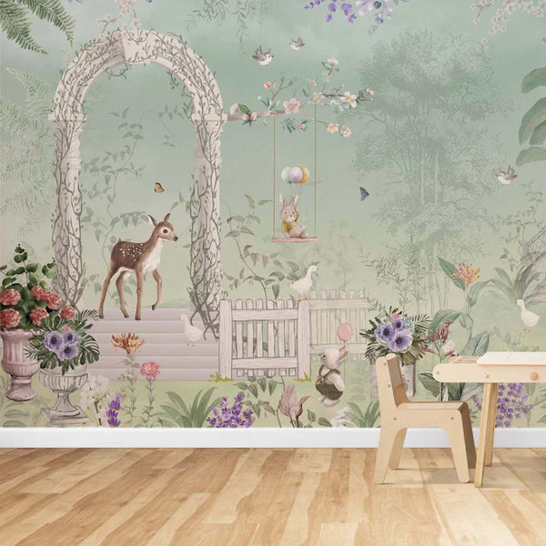 Wallpaper Kids Nursery Dubai Peps Wall A wall adorned with wallpaper featuring a forest and wildlife scene, including animals and plants, in a room with a wooden chair and a floral pattern on the wall.