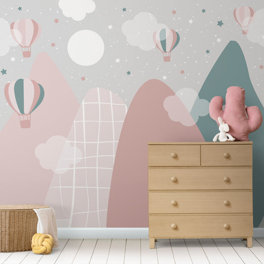 Wallpaper Kids Nursery Dubai Peps Wall Children's room with wallpaper featuring hot air balloons and geometric patterns, mounted on a wall above a wooden dresser.