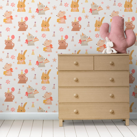 Wallpaper Kids Nursery Dubai Peps Wall A room with wallpaper featuring cute animal patterns, including a rabbit, a bear, and a pink umbrella, with a wooden dresser and a plush toy rabbit beside it.
