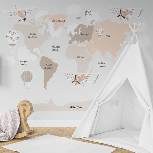 Wallpaper Kids Nursery Dubai Peps Wall A wall mural featuring a world map with various sections highlighted in beige, with decorative elements like a airplane and cloud illustrations. The room setting includes a white tent and a pink rug.