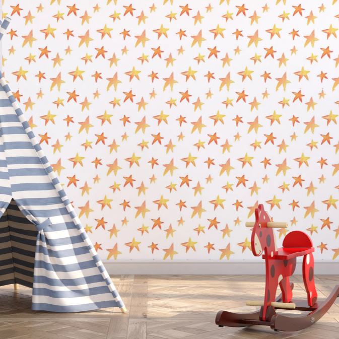 Wallpaper Kids Nursery Dubai Peps Wall A room with walls covered in orange star wallpaper, featuring a white and blue striped tent and a red rocking horse on the floor.