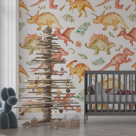 Wallpaper Kids Nursery Dubai Peps Wall A room with dinosaur wallpaper featuring various colorful dinosaurs such as a Diplodocus and Stegosaurus, and a decorative Christmas tree made of wooden sticks in the foreground.