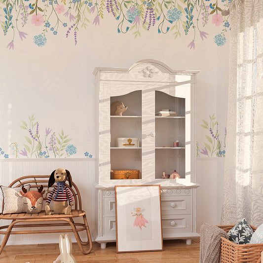 Wallpaper Kids Nursery Dubai Peps Wall A children's room with floral wallpaper, a white cabinet, and toys displayed. The room has a pastel color scheme and a magical theme.