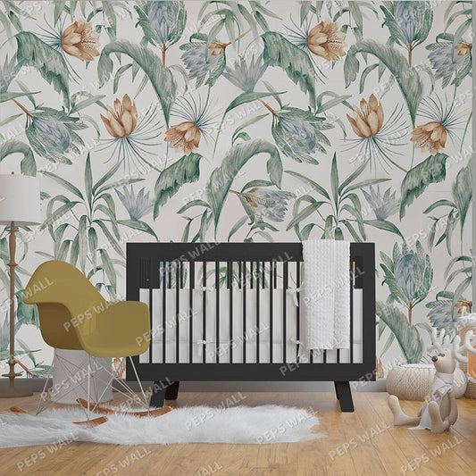 Wallpaper Kids Nursery Dubai Peps Wall A section of wallpaper with a floral leaf pattern in various shades of green, blue, and white, shown behind a black crib with a white bumper in a room with a yellow chair and a plush toy.