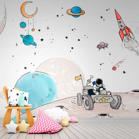 Wallpaper Kids Nursery Dubai Peps Wall A decorative wall mural featuring an astronaut theme with various space elements such as planets, stars, and a rocket. The scene is depicted in a whimsical style with soft colors.