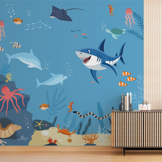 Wallpaper Kids Nursery Dubai Wallpaper with underwater scene featuring sharks, dolphins, and sea creatures on a blue background.