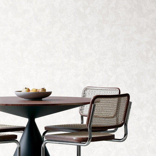 White textured fabric with a subtle gray leaf pattern.