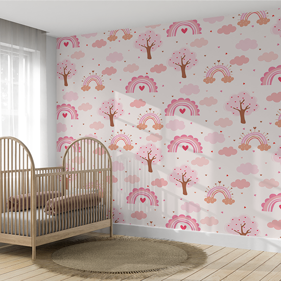 Children's room with a crib and patterned wall paper featuring trees, hearts, and rainbows.